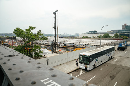 New York City, New York, USA - 08.02.2024: Passenger trains parked in a large rail yard beside...