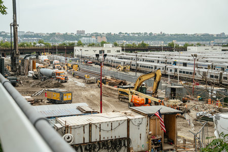 New York City, New York, USA - 08.02.2024: Heavy construction machinery operates beside multiple...