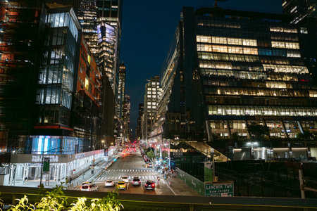 New York City, New York, USA - 08.02.2024: Traffic flows through Hudson Yards at night with the...