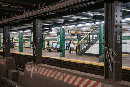 Passengers wait on the platform at West 4 Street subway station in Manhattan. The New York City...