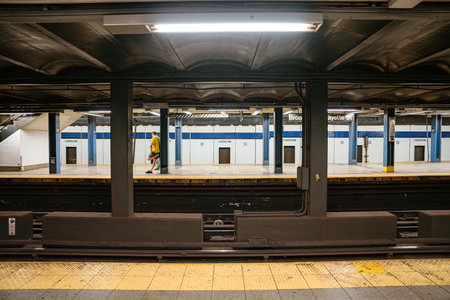 A commuter walks across the Broadway Lafayette Street subway platform in New York City. Underground...