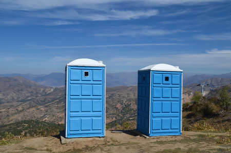 Two portable toilets on the top of the mountain for touristsの写真素材