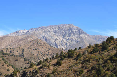 Fantastically beautiful mountains of Uzbekistan, landscape, blue sky, Sunny day. Mountain landscape in the mountains. Mountain Beldersay.の写真素材