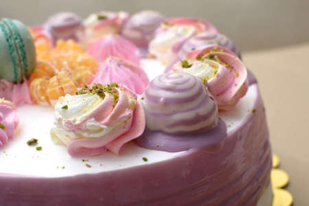 Decoration of whipped cream on the cake in the form of flowers and conesの写真素材