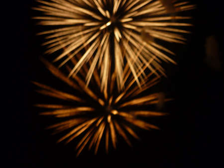 Festive fireworks in the black night sky blurred no focusの写真素材