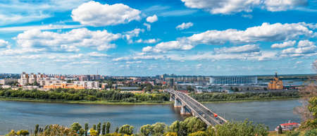 Panorama of Nizhny Novgorod, Russia. The Orthodox Cathedral of Alexander Nevsky, the soccer stadium and the bridgeの写真素材