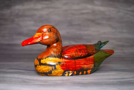 wooden duck on gray backgroundの写真素材