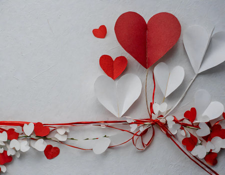 Valentine's day background with red and white paper hearts.の素材