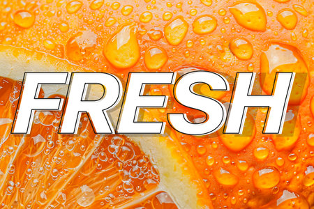 Fresh orange slice with water drops on it and the word fresh.の素材