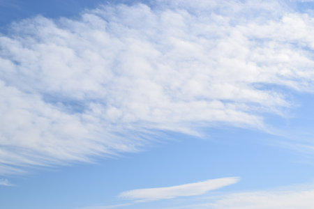 Blue sky with white clouds. Sky background. White clouds on blue sky.の写真素材
