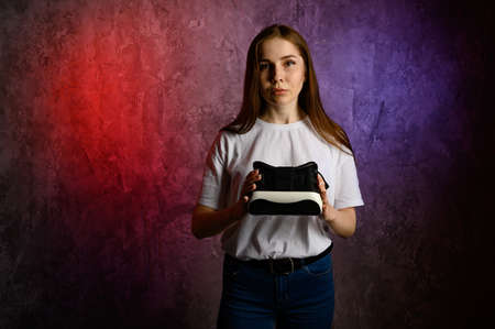 Happy young woman using a virtual reality headsetの写真素材