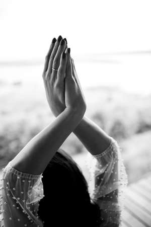 Interlacing hands. female hands on nature backgroundの写真素材