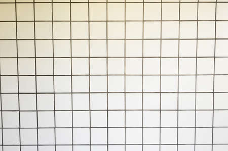 White Tiles wall texture. White ceramic tiles wall for background and used interior designの写真素材