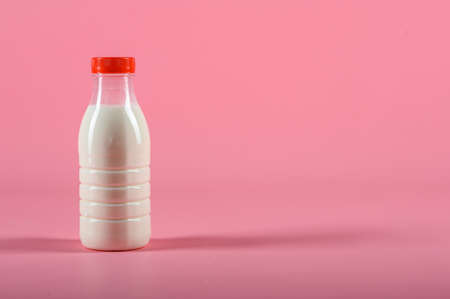 bottle of milk on a pink background. Mock upの写真素材