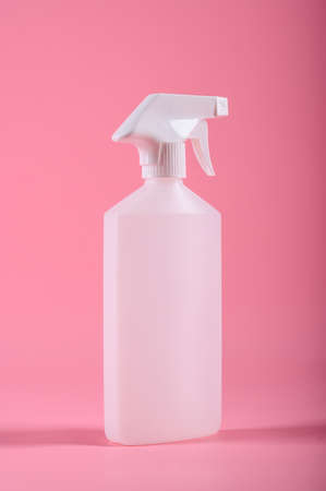 Cleaning tools. Spray bottle isolated on pink background. Mock upの写真素材