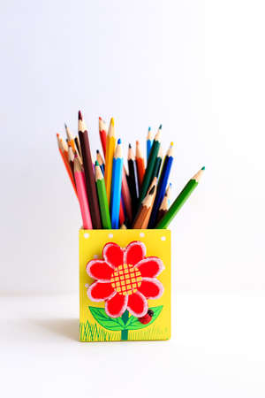 Colored pencils in a pencil case on white backgroundの写真素材