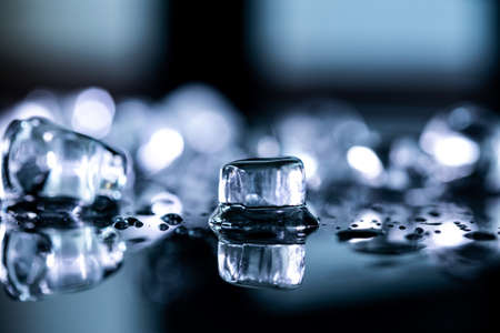 ice cubes reflection on black background. close up