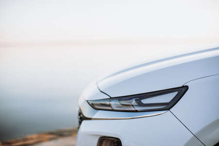 Close up detail on one of the LED headlights modern car.の写真素材