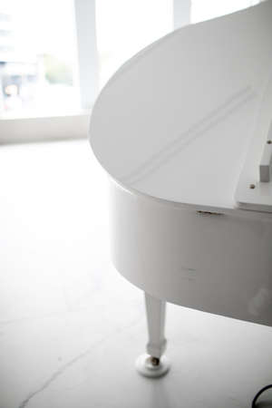 white grand piano on a white background. play musicの写真素材