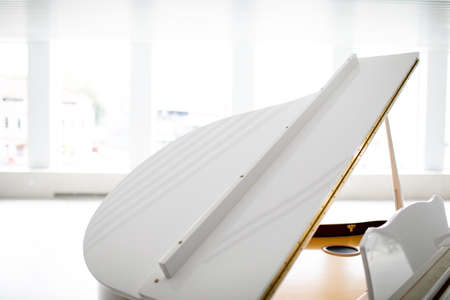 white grand piano on a white background. play musicの写真素材