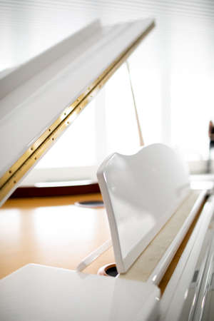 white grand piano on a white background. play musicの写真素材