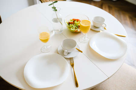 Table served for breakfast in living room, close up view.