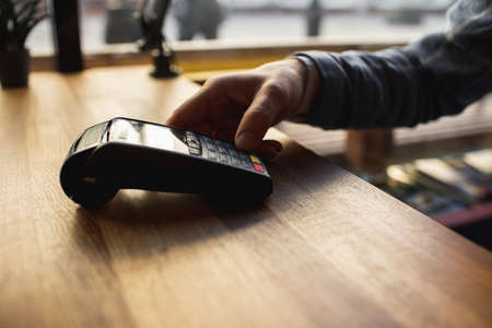 man enters data into a mobile terminal