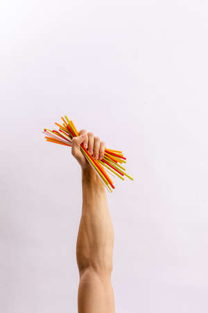 Hands hold trash on a light background. The concept of separate trash, stop plastic, recyclingの写真素材