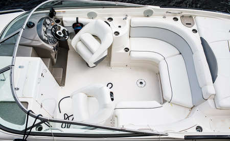 Pleasure boat. White tone. Steering wheel. 