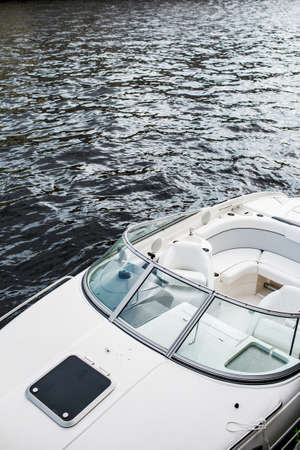 Pleasure boat. White tone. Steering wheel. 