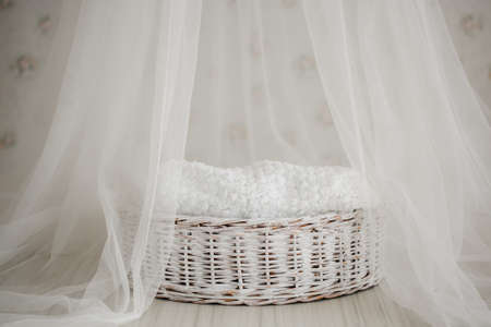 white cute cradle for a newborn. mattress for babies and healthy sleep in newbornsの写真素材