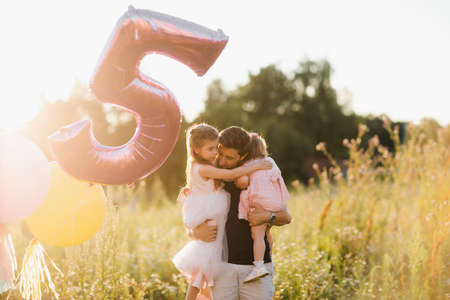 Fathers day. Happy family daughter hugs his dad on holidayの写真素材