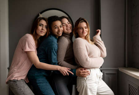 Group of young female friends hanging out at home. friendship, beauty, body positive and people...