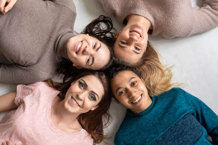Group of women with different body and ethnicity posing together to show the woman power and strength. Curvy and skinny kind of female body conceptの写真素材