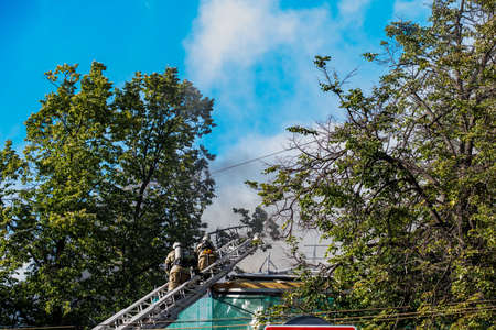 RUSSIA, Nizhny Novgorod - June 25, 2020: fire burns building. firefighters extinguish a building....
