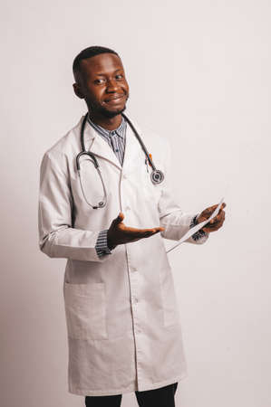 African-American black young doctor man isolated white background.の写真素材