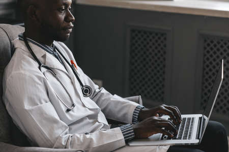 telehealth with virtual doctor appointment and online therapy session. Black doctor online conferenceの写真素材