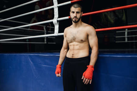 bare-chested boxer stands near the ring. boxingの写真素材
