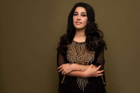 Muslim woman in hijab. Portrait of a young arab girl in traditional dress.