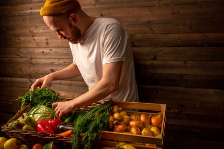 Farmer selling organic veg at market. Rustic style.Healthy food conceptの写真素材