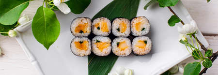 Rainbow Sushi Roll with salmon, tuna, avocado, royal prawn, cream cheese Philadelphia, caviar tobica, chuka. Sushi menu. Japanese foodの写真素材