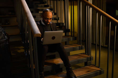 An African-American business man in a business suit is talking on a video conference. Video...