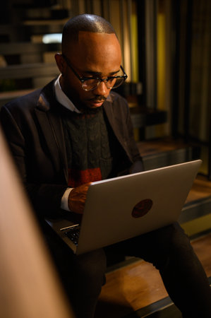 Confident young african man look at webcam conference video calling in office, happy mixed race...