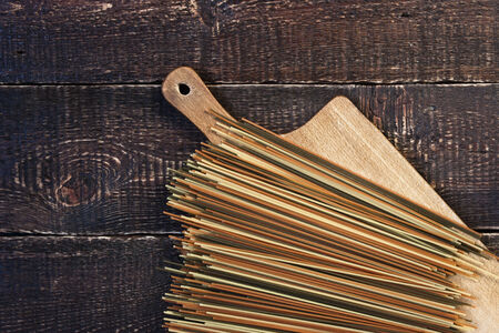 Raw pasta on the wooden boardの写真素材