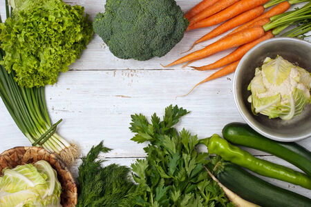 Different vegetables frame on the white wooden tableの写真素材