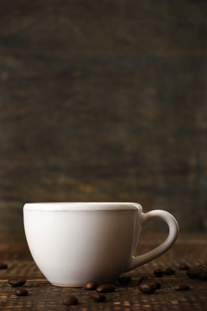 White ceramic coffee cup on the wooden tableの写真素材