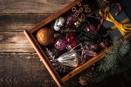 Wooden box with Christmas decorations and gift top viewの写真素材