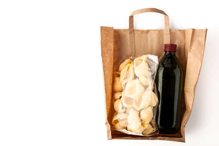 Pasta and olive oil inside a paper bagの写真素材