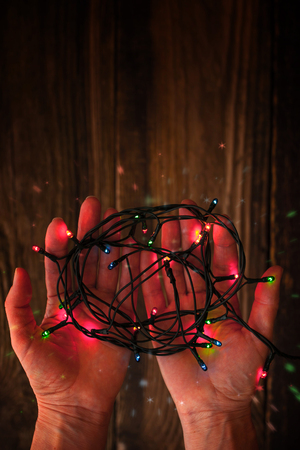 Ð¡olorful festoon in the hands  verticalの写真素材