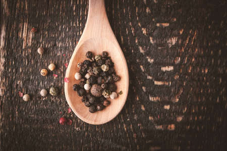 Pepper mix on the wooden spoon top viewの写真素材